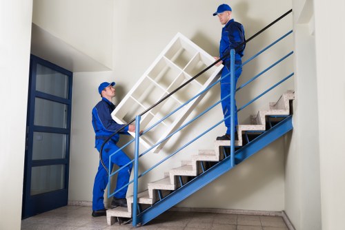 Professional flat removal team handling boxes in Westhendon
