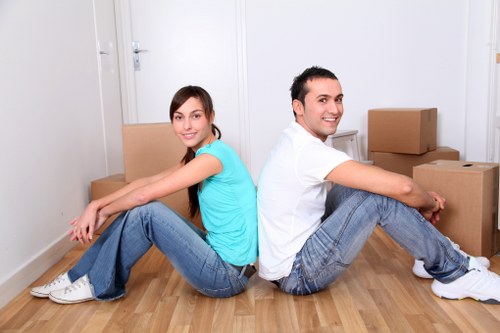 Staff preparing for office removals in Westhendon with labeled boxes and packing materials