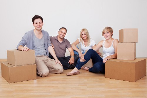 Careful packing and wrapping of fragile items during a flat removal